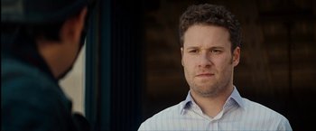 Movie still from “The Green Hornet” (2011), directed by Michel Gondry – A person wearing a dress shirt; Close Up shot, Over the shoulder angle