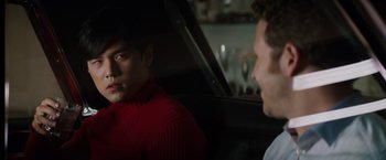 Movie still from “The Green Hornet” (2011), directed by Michel Gondry – Two men sitting in a car looking at each other; Close Up shot, Over the shoulder angle