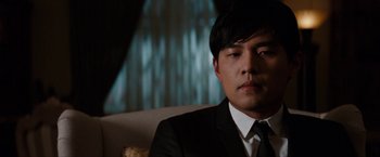 Movie still from “The Green Hornet” (2011), directed by Michel Gondry – A person wearing a suit and tie; Close Up shot, Over the shoulder angle