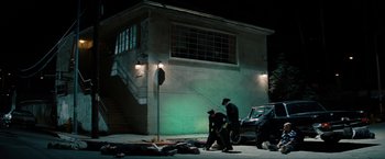 Movie still from “The Green Hornet” (2011), directed by Michel Gondry – A group of people walking down a street at night; Wide shot, High angle