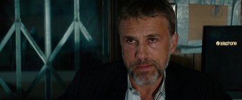 Movie still from “The Green Hornet” (2011), directed by Michel Gondry – A person wearing a suit and tie; Close Up shot, Over the shoulder angle