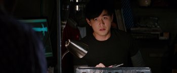 Movie still from “The Green Hornet” (2011), directed by Michel Gondry – A young man is standing in front of an oven; Close Up shot, High angle