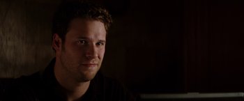 Movie still from “The Green Hornet” (2011), directed by Michel Gondry – A person wearing a black shirt; Close Up shot, Over the shoulder angle