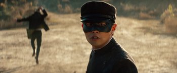Movie still from “The Green Hornet” (2011), directed by Michel Gondry – A young man wearing a hat and a mask; Close Up shot, Low angle