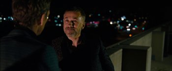 Movie still from “The Green Hornet” (2011), directed by Michel Gondry – A person wearing a black shirt; Close Up shot, Over the shoulder angle