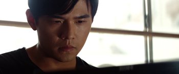 Movie still from “The Green Hornet” (2011), directed by Michel Gondry – A person looking down at his face; Close Up shot, Low angle