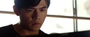 Movie still from “The Green Hornet” (2011), directed by Michel Gondry – A man's face in the sunlight; Close Up shot, Low angle