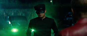 Movie still from “The Green Hornet” (2011), directed by Michel Gondry – A man wearing a black mask and a black hat; Medium shot, Low angle