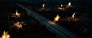 Movie still from “The Green Hornet” (2011), directed by Michel Gondry – An aerial view of a highway with a lot of cars on it; Extreme Wide shot, High angle