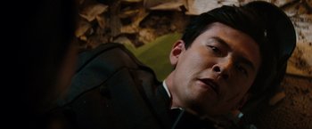 Movie still from “The Green Hornet” (2011), directed by Michel Gondry – A person laying on the ground; Close Up shot, High angle
