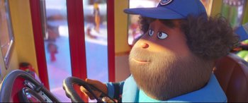 Movie still from “The Grinch” (2018), directed by Yarrow Cheney – A man with a beard is sitting in a car; Close Up shot, Over the shoulder angle