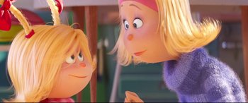 Movie still from “The Grinch” (2018), directed by Yarrow Cheney – A person's face and a woman's face; Close Up shot, Over the shoulder angle