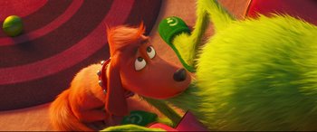 Movie still from “The Grinch” (2018), directed by Yarrow Cheney – A dog's face in a scene from dr; Close Up shot, Over the shoulder angle