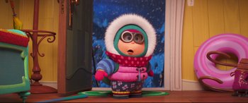 Movie still from “The Grinch” (2018), directed by Yarrow Cheney – A stuffed doll with a fur coat and hat on it; Medium shot, Over the shoulder angle