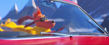 Movie still from “The Grinch” (2018), directed by Yarrow Cheney – A stuffed animal in the driver's seat of a red car; Wide shot, High angle