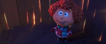 Movie still from “The Grinch” (2018), directed by Yarrow Cheney – A doll with a red head; Medium shot, Over the shoulder angle