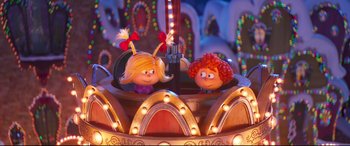 Movie still from “The Grinch” (2018), directed by Yarrow Cheney – A couple of people sitting on top of a carnival ride; Medium shot, Over the shoulder angle