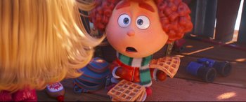 Movie still from “The Grinch” (2018), directed by Yarrow Cheney – A doll with waffles on a table; Close Up shot, Over the shoulder angle