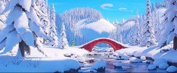 Movie still from “The Grinch” (2018), directed by Yarrow Cheney – A person standing in the snow next to a bridge; Extreme Wide shot, Low angle