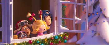 Movie still from “The Grinch” (2018), directed by Yarrow Cheney – A couple of people that are looking out of a window; Medium shot, Over the shoulder angle