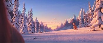 Movie still from “The Grinch” (2018), directed by Yarrow Cheney – An animated scene of a snowy mountain range with trees; Extreme Wide shot, High angle