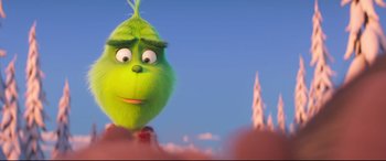 Movie still from “The Grinch” (2018), directed by Yarrow Cheney – A green character is standing in front of a castle; Close Up shot, Over the shoulder angle