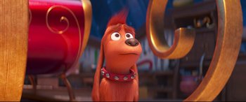 Movie still from “The Grinch” (2018), directed by Yarrow Cheney – A dog wearing a red collar; Close Up shot, Over the shoulder angle