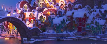 Movie still from “The Grinch” (2018), directed by Yarrow Cheney – A city with a lot of snow on the ground; Extreme Wide shot, High angle