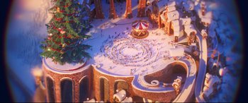 Movie still from “The Grinch” (2018), directed by Yarrow Cheney – An aerial view of a crowd of people gathered in the snow; Extreme Wide shot, High angle