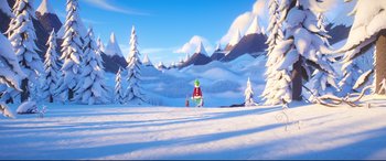 Movie still from “The Grinch” (2018), directed by Yarrow Cheney – A snowy landscape with trees and mountains in the background; Extreme Wide shot, High angle