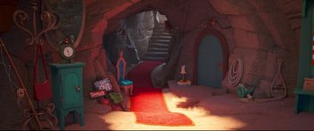 Movie still from “The Grinch” (2018), directed by Yarrow Cheney – A red carpet in the middle of an entrance way; Extreme Wide shot, High angle