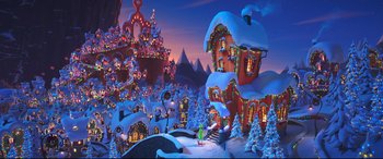Movie still from “The Grinch” (2018), directed by Yarrow Cheney – A snowy town with a lot of lights on it; Extreme Wide shot, High angle
