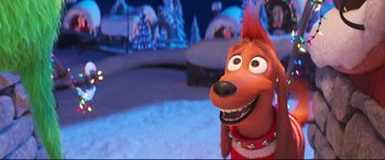 Movie still from “The Grinch” (2018), directed by Yarrow Cheney – A dog that is standing up in the snow; Close Up shot, Over the shoulder angle