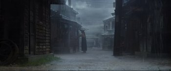 Movie still from “The Handmaiden” (2016), directed by Park Chan-wook – A woman holding an umbrella while standing in the rain; Extreme Wide shot, Low angle