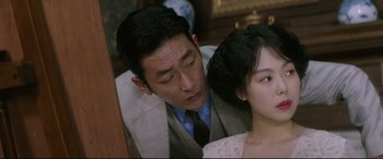 Movie still from “The Handmaiden” (2016), directed by Park Chan-wook – A man and a woman sitting next to each other in a room; Close Up shot, Over the shoulder angle