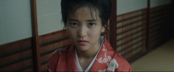Movie still from “The Handmaiden” (2016), directed by Park Chan-wook – A young woman in a red and white kimono; Close Up shot, High angle