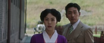 Movie still from “The Handmaiden” (2016), directed by Park Chan-wook – A woman in a purple dress and a man in a suit; Close Up shot, Over the shoulder angle