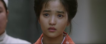 Movie still from “The Handmaiden” (2016), directed by Park Chan-wook – A person wearing a shirt; Close Up shot, Over the shoulder angle