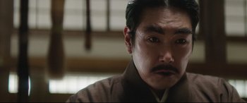 Movie still from “The Handmaiden” (2016), directed by Park Chan-wook – A person with a mustache; Close Up shot, Low angle