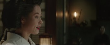 Movie still from “The Handmaiden” (2016), directed by Park Chan-wook – A person with red lipstick on her lips; Close Up shot, Over the shoulder angle