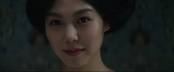 Movie still from “The Handmaiden” (2016), directed by Park Chan-wook – A young woman's face; Close Up shot, Over the shoulder angle