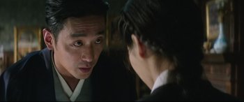 Movie still from “The Handmaiden” (2016), directed by Park Chan-wook – A man and a woman looking at one another; Close Up shot, Over the shoulder angle