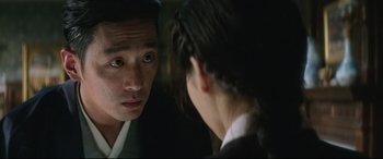 Movie still from “The Handmaiden” (2016), directed by Park Chan-wook – A man and a woman looking at one another in the mirror; Close Up shot, Over the shoulder angle