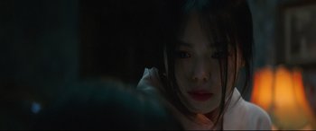 Movie still from “The Handmaiden” (2016), directed by Park Chan-wook – A young girl is looking into the camera; Close Up shot, Over the shoulder angle