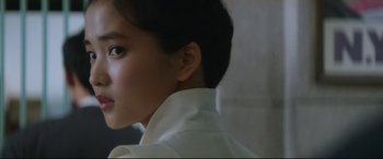 Movie still from “The Handmaiden” (2016), directed by Park Chan-wook – A woman in a white shirt is looking to the side; Close Up shot, Low angle