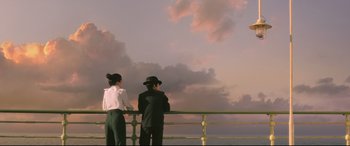 Movie still from “The Handmaiden” (2016), directed by Park Chan-wook – A man and a woman standing on a bridge looking at the sky; Wide shot, Low angle