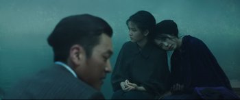 Movie still from “The Handmaiden” (2016), directed by Park Chan-wook – Two women and a man are sitting in a room; Medium shot, Over the shoulder angle