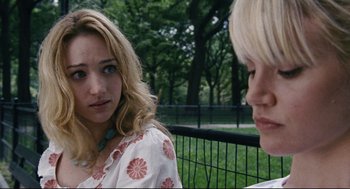 Movie still from “The Happening” (2008), directed by M. Night Shyamalan – Two young women sitting on a bench in a park; Close Up shot, Over the shoulder angle