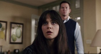 Movie still from “The Happening” (2008), directed by M. Night Shyamalan – A young woman standing in front of a man in a room; Close Up shot, Over the shoulder angle
