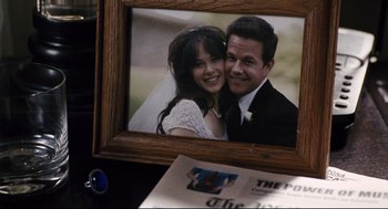 Movie still from “The Happening” (2008), directed by M. Night Shyamalan – A picture of a man and a woman in a picture frame; Close Up shot, Overhead angle